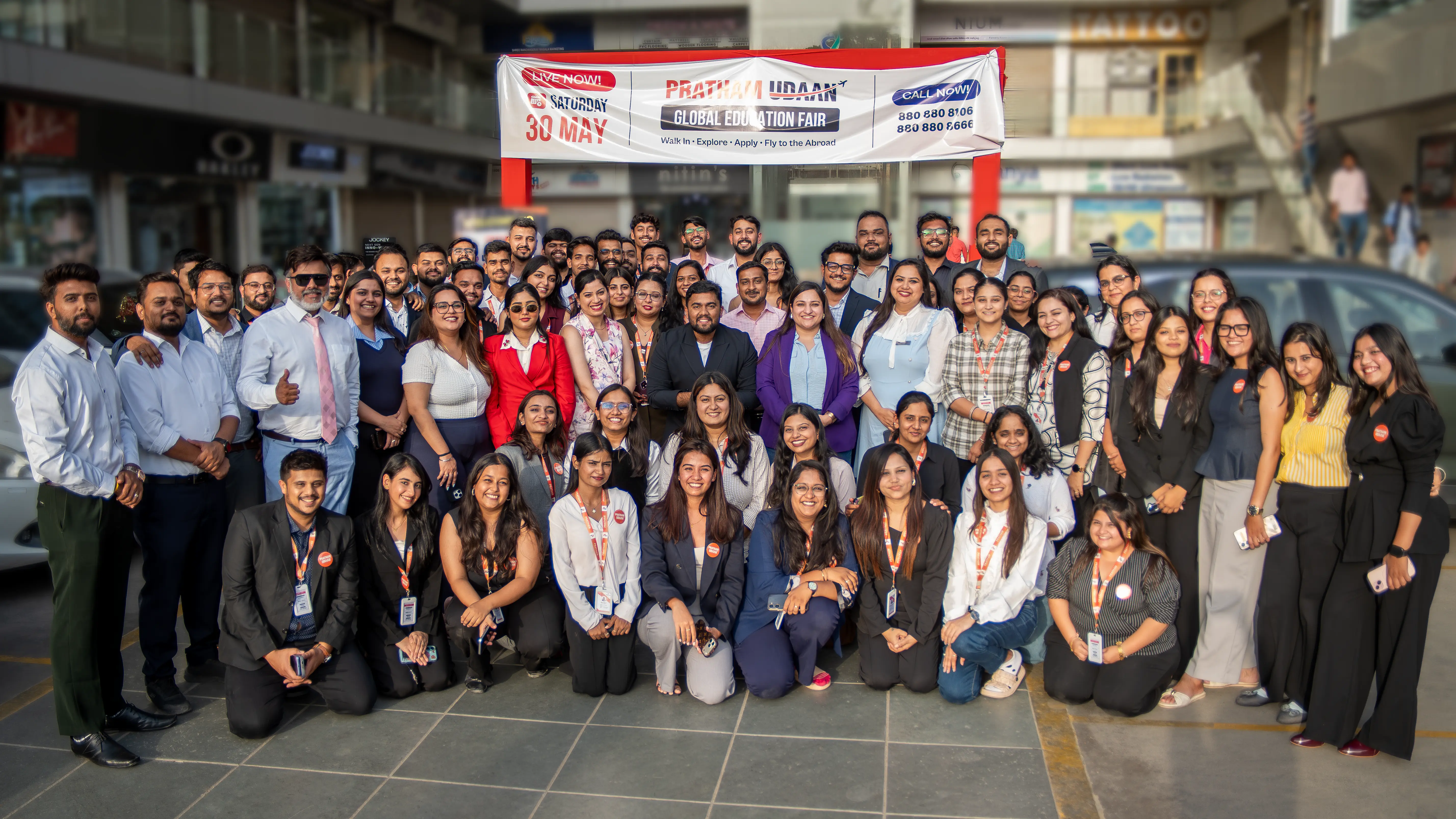 Pratham International team with university representatives at a previous education fair